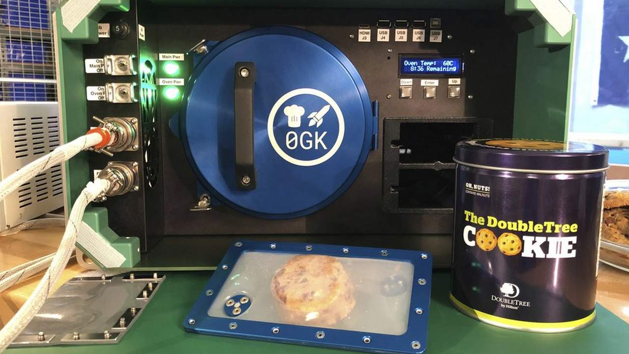 The oven, individual cookie dough and the box of cookies being sent to the ISS. Image credit: AFP