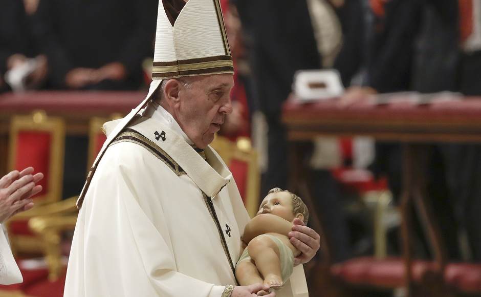 Pope Francis held a statue of Baby Jesus as he left after celebrating Christmas Eve Mass in St Peter's Basilica at the Vatican. "Christmas reminds us that God continues to love us all, even the worst of us," Francis, presiding at the seventh Christmas season of his pontificate, said in his sermon. AP Pope Francis held a statue of Baby Jesus as he left after celebrating Christmas Eve Mass in St Peter's Basilica at the Vatican. "Christmas reminds us that God continues to love us all, even the worst of us," Francis, presiding at the seventh Christmas season of his pontificate, said in his sermon. AP