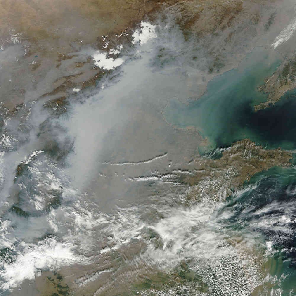Satellite images show pollution and haze over China.