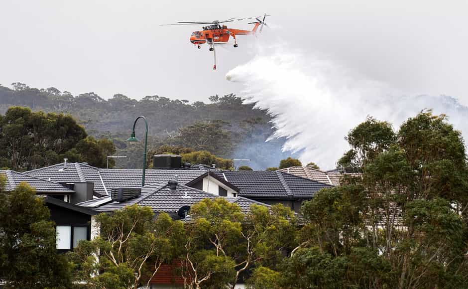 Skycrane used to drop water on a bushfire in scrub behind houses in Bundoora, Melbourne. New Year’s Eve fireworks in Australia’s capital and other cities have been canceled as the wildfire danger worsens in oppressive summer heat, and pressure was building for Sydney’s iconic celebrations to be similarly scrapped. AP Skycrane used to drop water on a bushfire in scrub behind houses in Bundoora, Melbourne. New Year’s Eve fireworks in Australia’s capital and other cities have been canceled as the wildfire danger worsens in oppressive summer heat, and pressure was building for Sydney’s iconic celebrations to be similarly scrapped. AP