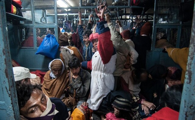 After the holy dip, exhausted pilgrims head back to Sealdah station by a local train. After the holy dip, exhausted pilgrims head back to Sealdah station by a local train.