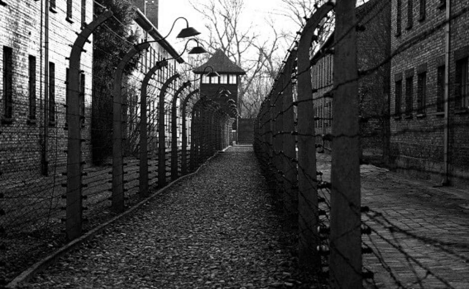 A pathway leading to an observation and security tower between what were electric barbed wire fences inside the concentration camp, Auschwitz I. The Associated Press/ Markus Schreiber A pathway leading to an observation and security tower between what were electric barbed wire fences inside the concentration camp, Auschwitz I. The Associated Press/ Markus Schreiber