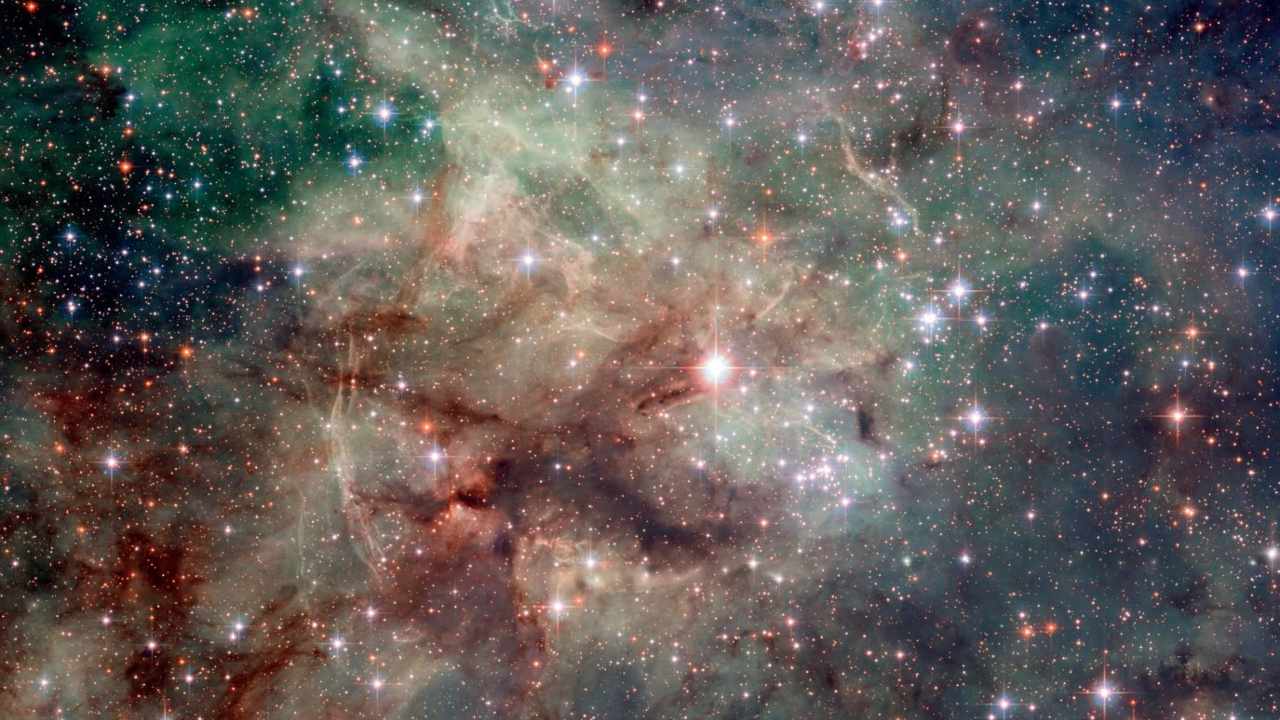 Hubble captured a stunning close-up shot of part of the Tarantula Nebula, which is the most luminous nebula of its type in the local Universe. This star-forming region is rich in ionised hydrogen gas in the Large Magellanic Cloud, a small galaxy which neighbours the Milky Way. Image credit: ESA/Hubble Hubble captured a stunning close-up shot of part of the Tarantula Nebula, which is the most luminous nebula of its type in the local Universe. This star-forming region is rich in ionised hydrogen gas in the Large Magellanic Cloud, a small galaxy which neighbours the Milky Way. Image credit: ESA/Hubble