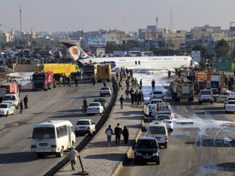 Aging Iranian passenger aircraft carrying 144 crash-lands and skids onto busy highway, only two injured Aging Iranian passenger aircraft carrying 144 crash-lands and skids onto busy highway, only two injured