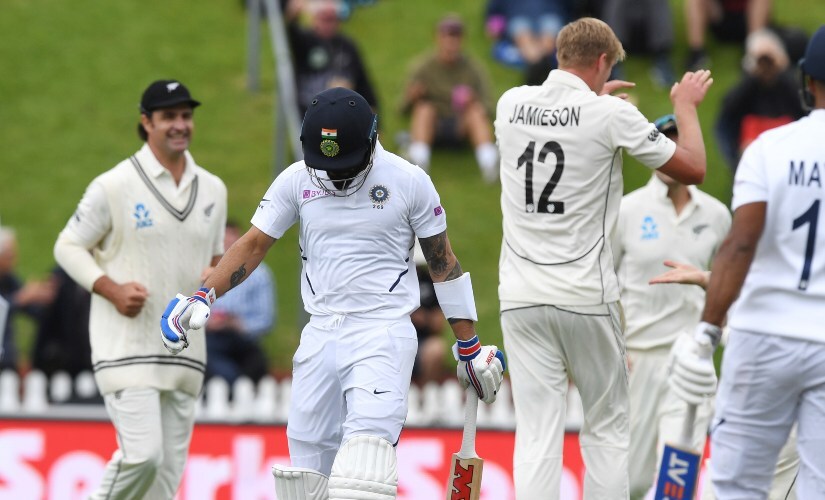 India's Virat Kohli, centre, walks past a celebrating New Zealand’s Kyle Jamieson after being dismissed for 2 during the first India vs New Zealand Test. AP India's Virat Kohli, centre, walks past a celebrating New Zealand’s Kyle Jamieson after being dismissed for 2 during the first India vs New Zealand Test. AP