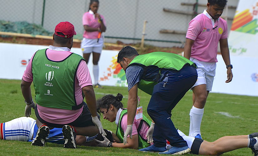 Vahbiz Bharucha talks to an injured player on Wednesday in her capacity as a physiotherapist during the Khelo India University Games being held in Bhubaneswar. Image courtesy: Khelo India University Games