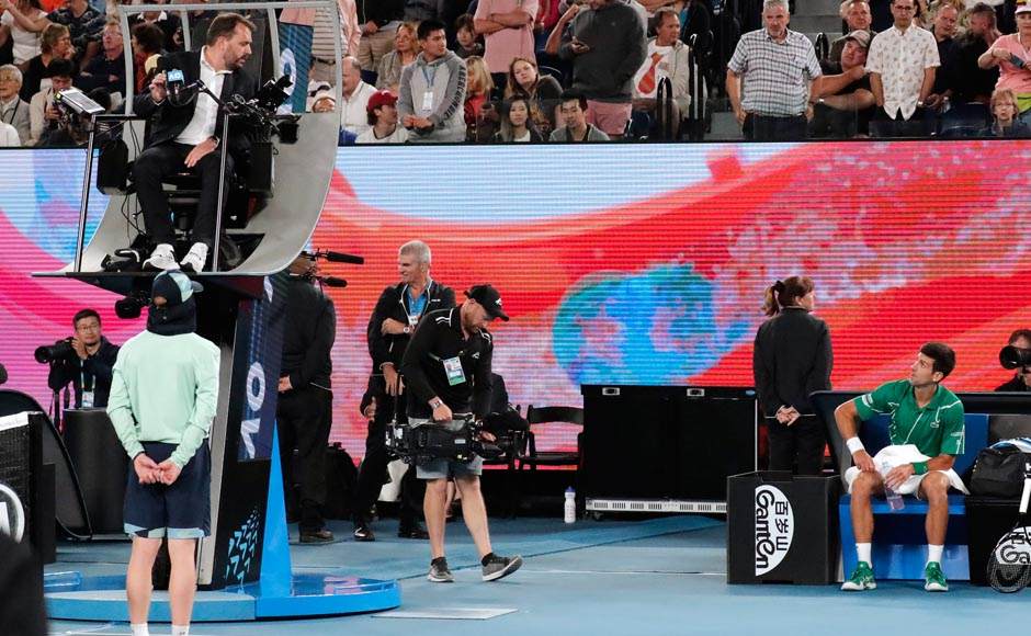 Fifth-seeded Thiem broke again in the next game after Djokovic was first warned by chair umpire Damien Dumusois for exceeding the 25-second serve clock at 15-30 and then penalized with a fault on break point for exceeding the time allowance again. Thiem then held to win the set. AP Fifth-seeded Thiem broke again in the next game after Djokovic was first warned by chair umpire Damien Dumusois for exceeding the 25-second serve clock at 15-30 and then penalized with a fault on break point for exceeding the time allowance again. Thiem then held to win the set. AP