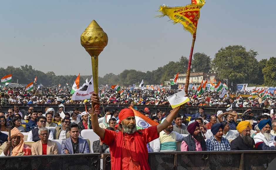 AAP supporters flocked to the venue in large numbers, some carrying the National Flag, some others carrying posters with slogans like "lage raho Kejriwal." An AAP volunteer carried a mace, the symbol of Hanuman. PTI AAP supporters flocked to the venue in large numbers, some carrying the National Flag, some others carrying posters with slogans like "lage raho Kejriwal." An AAP volunteer carried a mace, the symbol of Hanuman. PTI
