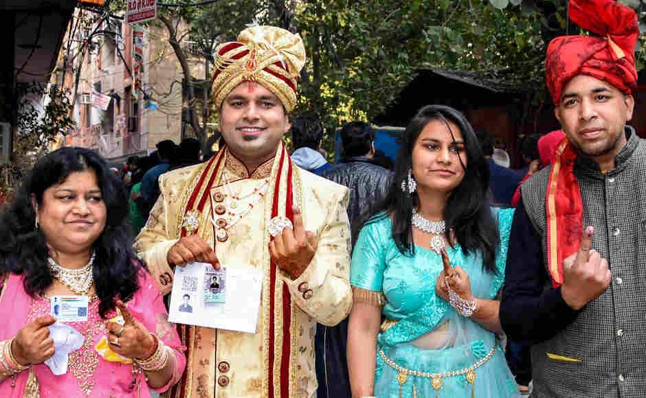 A groom and his family members after casting their votes for Delhi Assembly elections in east Delhi. PTI A groom and his family members after casting their votes for Delhi Assembly elections in east Delhi. PTI