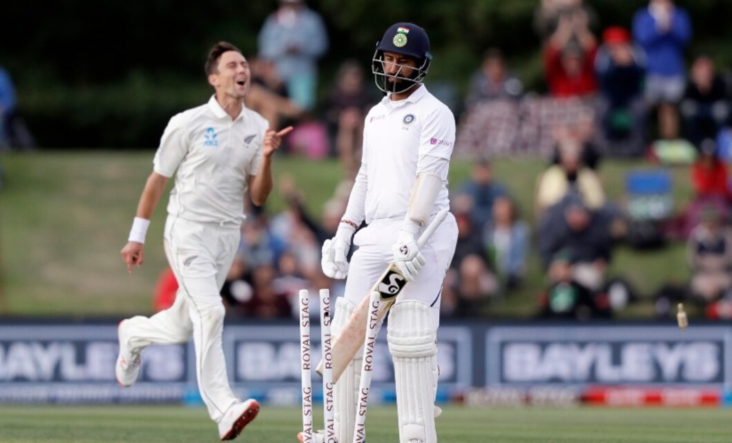 India's Cheteshwar Pujari, centre, walks from the field after he was out bowled for 24 by New Zealand's Trent Boult, right, during play on day two of the second Test between New Zealand and India. AP India's Cheteshwar Pujari, centre, walks from the field after he was out bowled for 24 by New Zealand's Trent Boult, right, during play on day two of the second Test between New Zealand and India. AP
