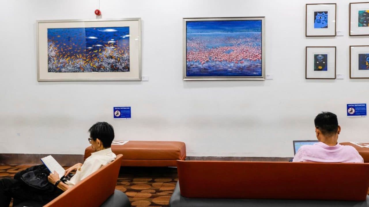 visitors observe new social distancing measures recommended at the National Library in Singapore. Image credit: AP