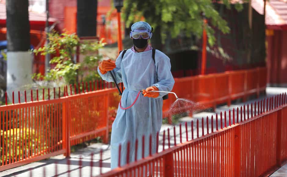 A municipal worker sprays disinfectants as a precautionary measure against COVID-19 outside a temple in Jammu. 206 cases confirmed in India so far, says the health ministry. AP A municipal worker sprays disinfectants as a precautionary measure against COVID-19 outside a temple in Jammu. 206 cases confirmed in India so far, says the health ministry. AP