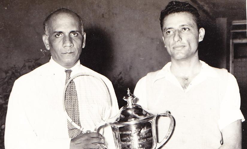 George Lewis with a trophy won with doubles partner Farokh Antia