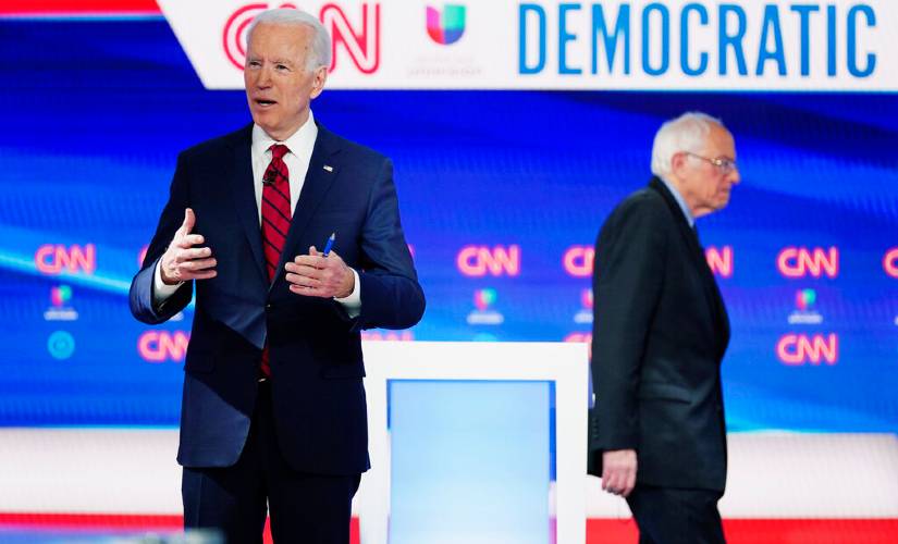 Senator Bernie Sanders (right) ended his presidential bid on Wednesday, acknowledging former vice president Joe Biden (left) is too far ahead for him to have any reasonable hope of catching up. AP
