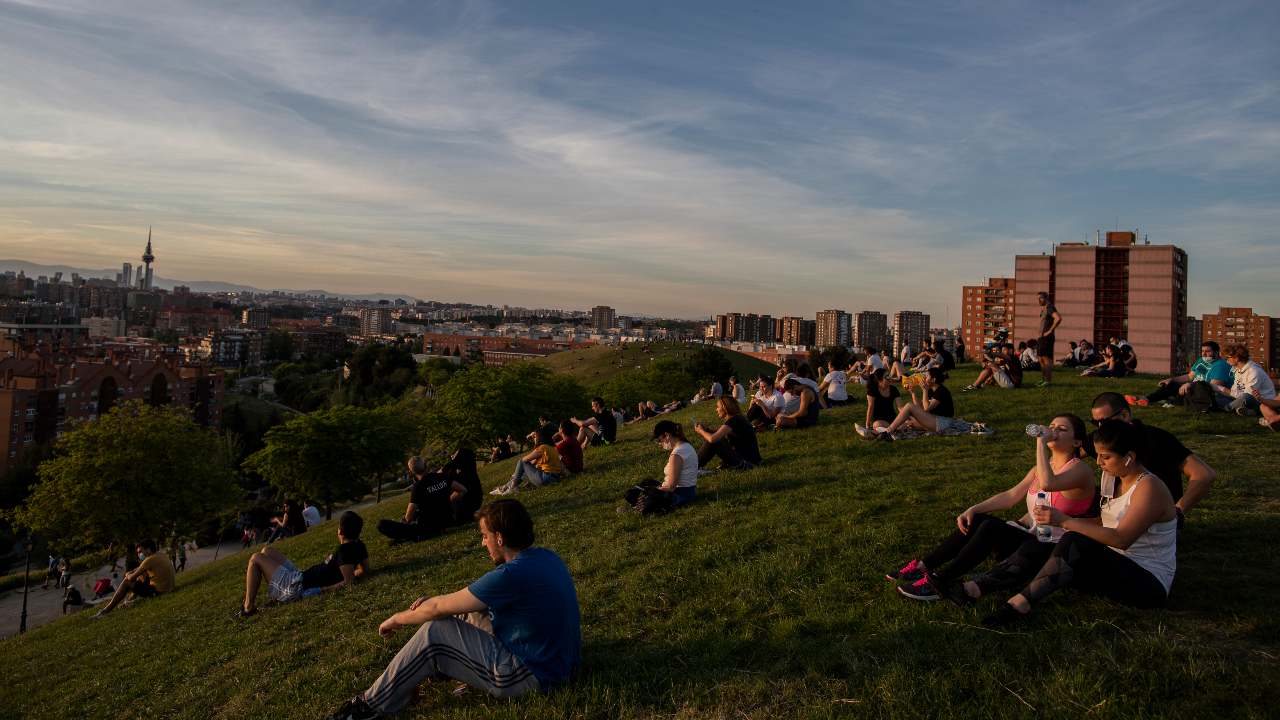 People sit in the Cerro del Tio Pio park in Madrid, Spain, Spain, Sunday, May 3, 2020. On Saturday, Spaniards were able to go outdoors to do exercise for the first time in seven weeks since the lockdown began to battle the coronavirus outbreak. (AP Photo/Manu Fernandez)