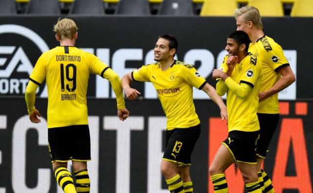 Borussia Dortmund provided early fireworks with a 4-0 demolition of bitter rivals Schalke. Goal celebrations, much like in other games, were limited to occasional elbow or fist bump or simply smiles. AP Borussia Dortmund provided early fireworks with a 4-0 demolition of bitter rivals Schalke. Goal celebrations, much like in other games, were limited to occasional elbow or fist bump or simply smiles. AP