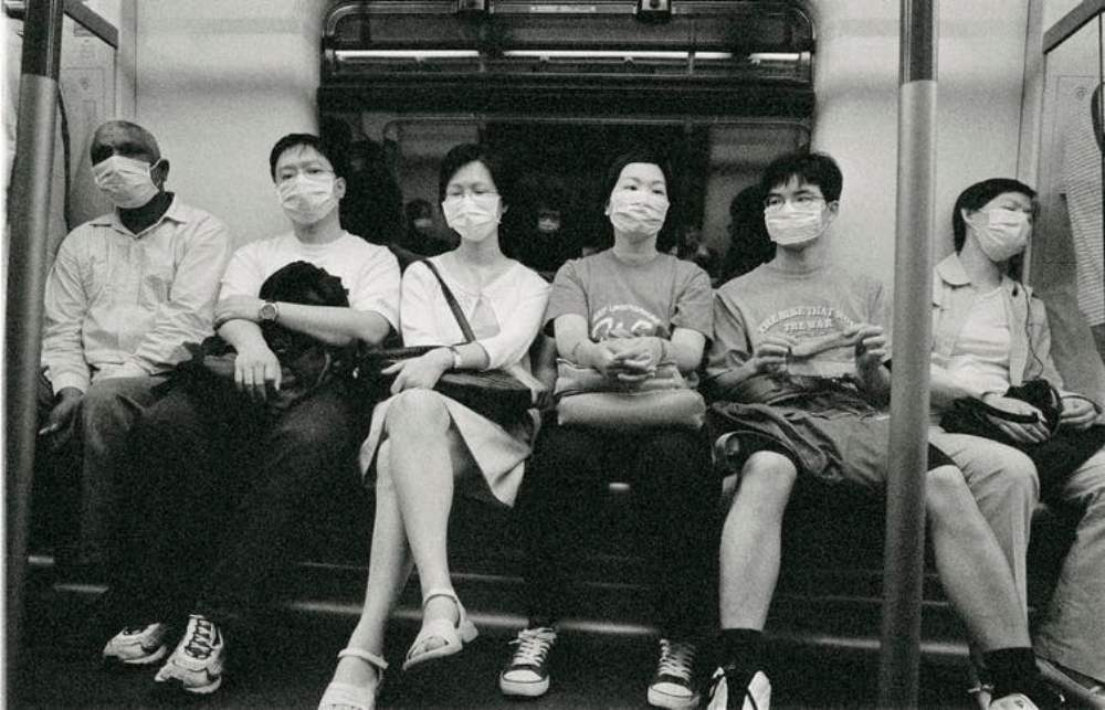 From 2003, in Hong Kong, people riding the subway during the SARS outbreak. Image credit: Getty Images / xPacifica