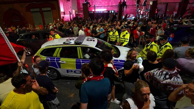 A police vehicle arrives at the Anfield, where Liverpool fans gathered to celebrate their team clinching the top-flight title. AP A police vehicle arrives at the Anfield, where Liverpool fans gathered to celebrate their team clinching the top-flight title. AP