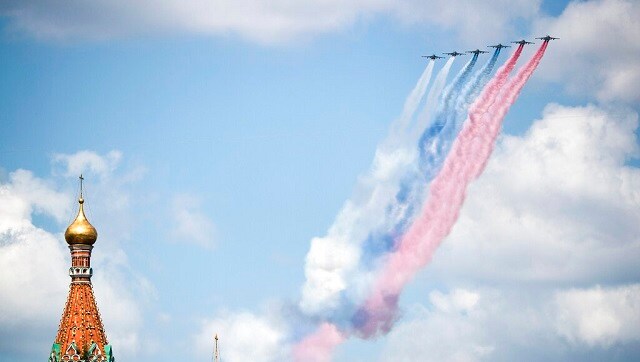 The display of military might was completed with a flyover of helicopters, bombers and fighter planes. with some leaving trails of smoke in colors of Russia's national flag. AP The display of military might was completed with a flyover of helicopters, bombers and fighter planes. with some leaving trails of smoke in colors of Russia's national flag. AP