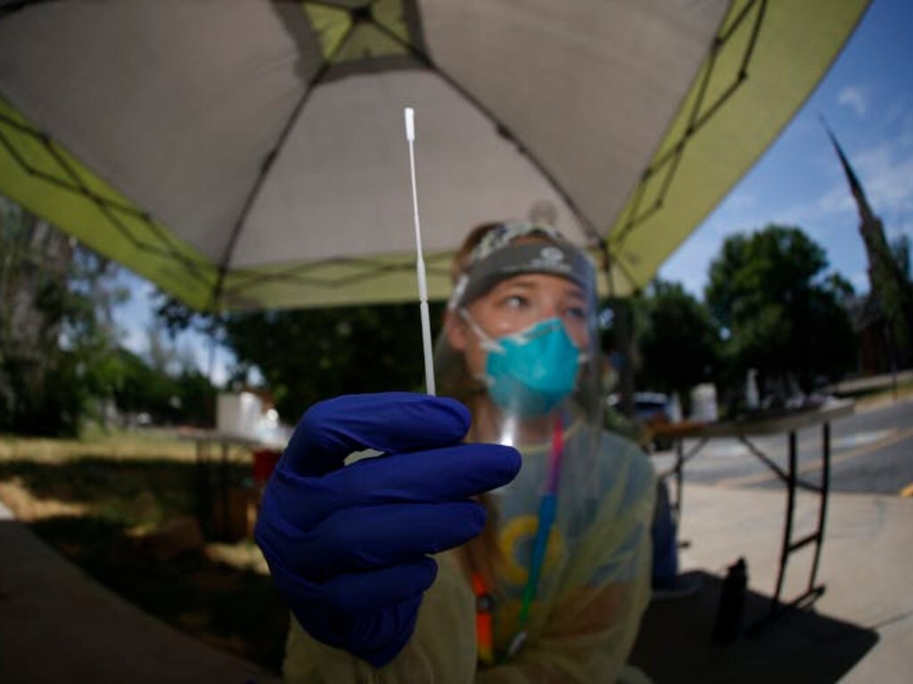 For pooled testing, individual samples are collected, then multiple samples are mixed together and screened using a PCR test that looks for bits of viral RNA. AP Photo/David Zalubowski