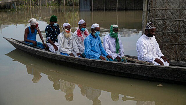 In Assam, which is reeling under the dual onslaught of floods and COVID-19, most people remained indoors due to restrictions imposed by the state government. Only in Kamrup, Karbi Anglong and Barpeta, authorities permitted the presence of three persons, including imams. AP In Assam, which is reeling under the dual onslaught of floods and COVID-19, most people remained indoors due to restrictions imposed by the state government. Only in Kamrup, Karbi Anglong and Barpeta, authorities permitted the presence of three persons, including imams. AP