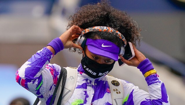 Naomi Osaka takes off her headphones as she enters the court for the women's singles final. AP Naomi Osaka takes off her headphones as she enters the court for the women's singles final. AP