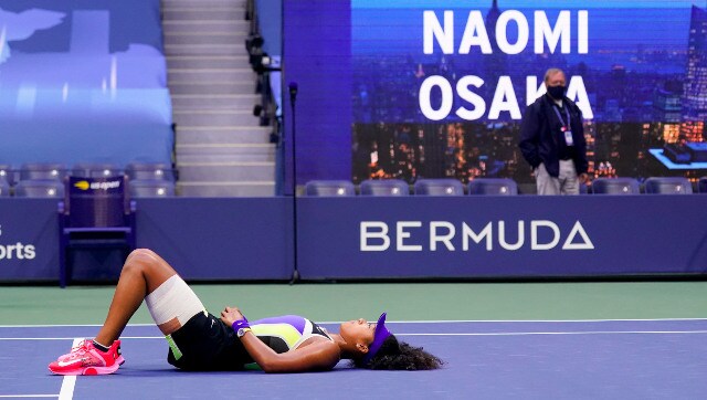 Naomi Osaka lies on the ground after finally clinching her third Grand Slam title. AP Naomi Osaka lies on the ground after finally clinching her third Grand Slam title. AP