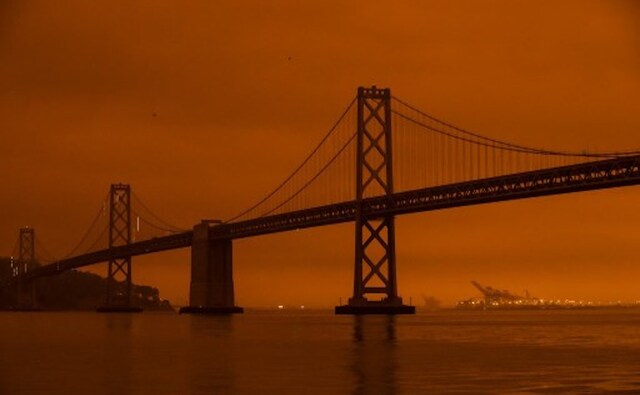 In California, people in the San Francisco Bay Area awoke to a deep orange sky caused by wildfire smoke that at times blocked out sunlight entirely. Photos of the eerie scene, particularly of a San Francisco skyline fit for a dystopian science fiction film, spread quickly on social media. AFP In California, people in the San Francisco Bay Area awoke to a deep orange sky caused by wildfire smoke that at times blocked out sunlight entirely. Photos of the eerie scene, particularly of a San Francisco skyline fit for a dystopian science fiction film, spread quickly on social media. AFP