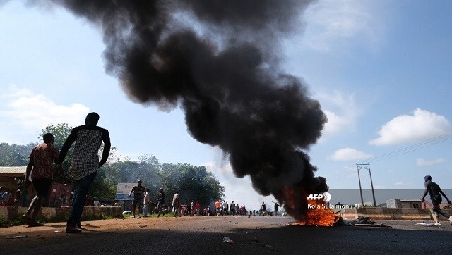 Nigeria declares 24-hour curfew in Lagos as violence flares during protests