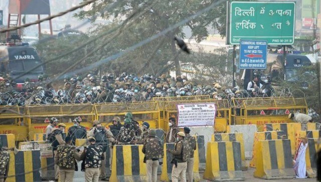 Security personnel and farmers clash as protestors attempt to cross Singhu border entry point. PTI Security personnel and farmers clash as protestors attempt to cross Singhu border entry point. PTI