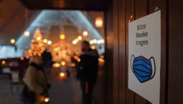 On the global front, celebrations were muted too, with all worshippers wearing masks. In this picture, a sign reads "Please wear a mask" as Christian worshippers arrive at the Petrus church in Bremerhaven for a "Christmas Vespers" mass in Bremerhaven, northern Germany. AFP On the global front, celebrations were muted too, with all worshippers wearing masks. In this picture, a sign reads "Please wear a mask" as Christian worshippers arrive at the Petrus church in Bremerhaven for a "Christmas Vespers" mass in Bremerhaven, northern Germany. AFP