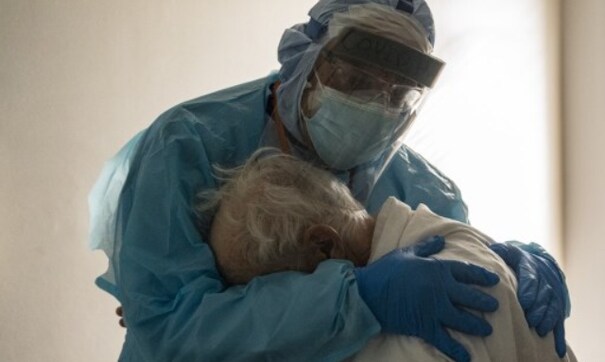 Hospital staff 'truly exhausted,' says Texas doctor on viral photo of him hugging elderly COVID-19 patient Hospital staff 'truly exhausted,' says Texas doctor on viral photo of him hugging elderly COVID-19 patient