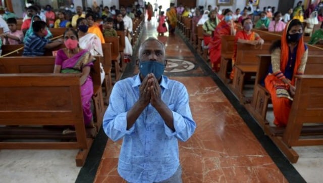 Christian devotees wearing facemasks as a preventive measure against the Covid-19 coronavirus offer prayers at Sacred Heart Shrine Church on Christmas in Chennai. AFP Christian devotees wearing facemasks as a preventive measure against the Covid-19 coronavirus offer prayers at Sacred Heart Shrine Church on Christmas in Chennai. AFP