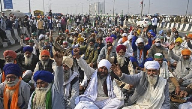 Thousands of farmers from Punjab, Haryana and neighbouring states have been protesting at various borders of the National Capital for 12 days. The three laws, they claim, will end the mandi system and minimum support price (MSP) procurement system for the benefits of corporates. They have demanded that the laws be repealed. Image Credits: AFP