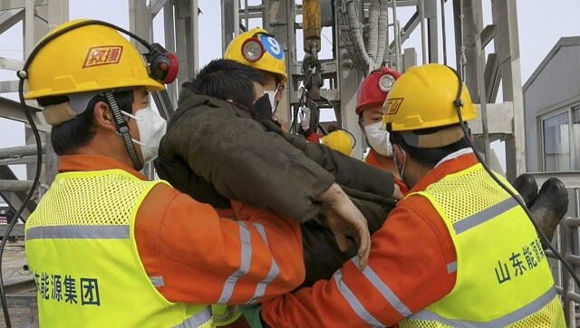 Rescue workers safely extract 11 trapped in Chinese gold mine for two weeks