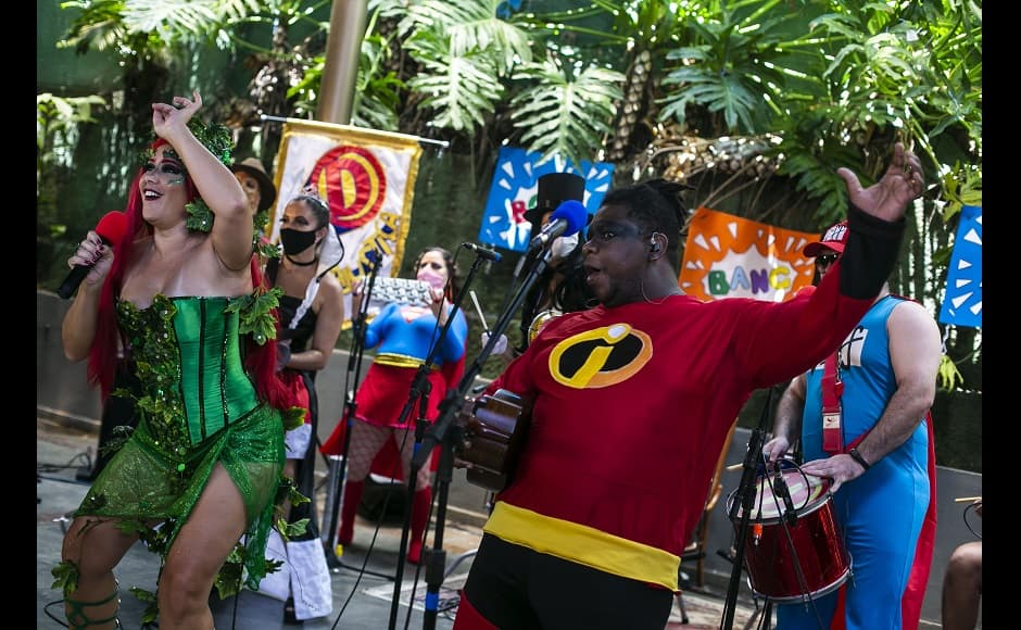 Musicians of the "Desliga da Justica" street band perform in Rio de Janeiro, Brazil on Sunday. The group featured in costumes of Supergirl, Freddy Krueger, Poison Ivy and Captain America and they kicked off, into a song. That idiosyncratic lineup is a typical sort of lineup for the Carnival street band Desliga da Justica, but this year they were facing cameras in a studio and the fans were scattered across the internet instead of dancing in the streets during one of the world’s most iconic celebrations. Image via The Associated Press/Bruna Prado Musicians of the "Desliga da Justica" street band perform in Rio de Janeiro, Brazil on Sunday. The group featured in costumes of Supergirl, Freddy Krueger, Poison Ivy and Captain America and they kicked off, into a song. That idiosyncratic lineup is a typical sort of lineup for the Carnival street band Desliga da Justica, but this year they were facing cameras in a studio and the fans were scattered across the internet instead of dancing in the streets during one of the world’s most iconic celebrations. Image via The Associated Press/Bruna Prado