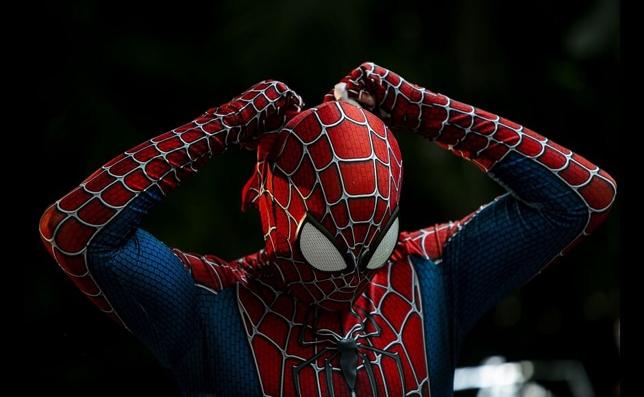 A member of the "Desliga da Justica" — the name is a Portuguese language play on “Justice League” — street band gets dressed in his spiderman costume in Rio de Janeiro, Brazil on Sunday, 14 February 2021. The group's performance was broadcast live on social media for those who were unable to participate in the carnival due to COVID restrictions after the city's government officially suspended Carnival and banned street parades or clandestine parties. Image via The Associated Press/Bruna Prado A member of the "Desliga da Justica" — the name is a Portuguese language play on “Justice League” — street band gets dressed in his spiderman costume in Rio de Janeiro, Brazil on Sunday, 14 February 2021. The group's performance was broadcast live on social media for those who were unable to participate in the carnival due to COVID restrictions after the city's government officially suspended Carnival and banned street parades or clandestine parties. Image via The Associated Press/Bruna Prado