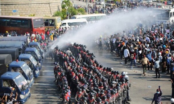 Protests swell in Myanmar week after military coup; police uses water cannon on protester Protests swell in Myanmar week after military coup; police uses water cannon on protester