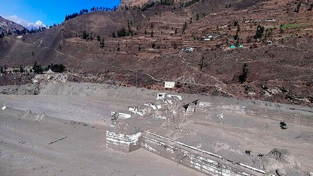 Two power projects – NTPC’s Tapovan-Vishnugad hydel project and the Rishi Ganga Hydel Project – were extensively damaged with scores of labourers trapped in tunnels as the waters came rushing in. In picture, a view of the hydropower project at the Reni village. AP