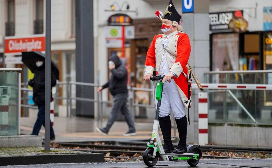 One of Germany’s first superspreader events stemmed from a Carnival celebration in a town west of Cologne in February 2020, where many people came into contact with an infected man. This year authorities are taking no chances, with public consumption of alcohol banned in some places. Here, a carnival reveller rides an electric scooter near the Severinstor gate in Cologne. Rolf Vennenbernd/dpa via AP One of Germany’s first superspreader events stemmed from a Carnival celebration in a town west of Cologne in February 2020, where many people came into contact with an infected man. This year authorities are taking no chances, with public consumption of alcohol banned in some places. Here, a carnival reveller rides an electric scooter near the Severinstor gate in Cologne. Rolf Vennenbernd/dpa via AP