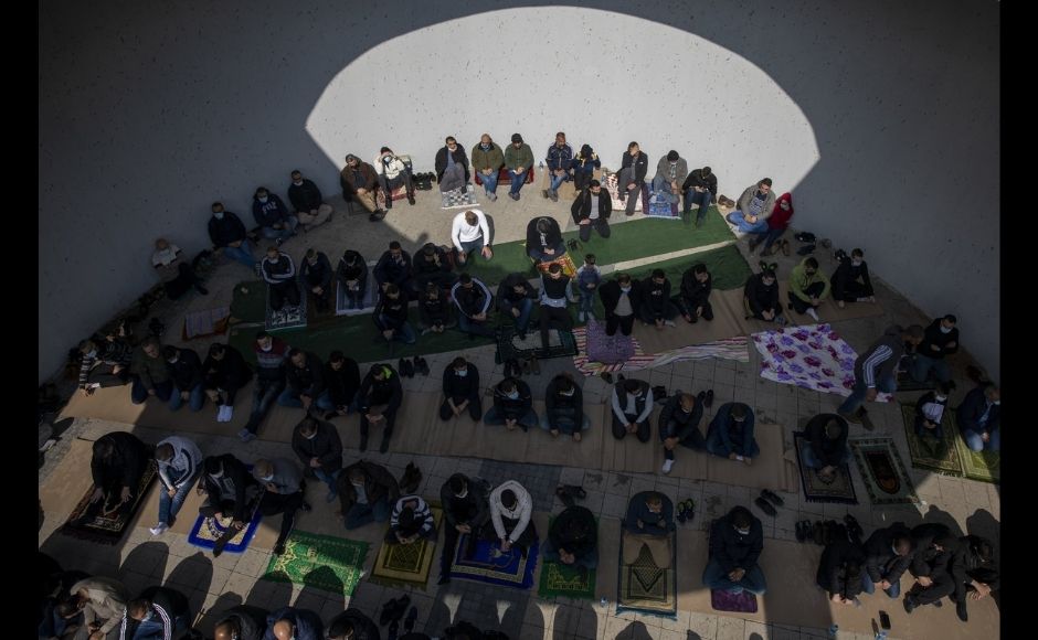 Muslim men gather to pray during a protest against Police lack of enforcement and recent rise in violence Arab communities in the northern Arab Israeli town of Umm el-Fahm, Israel, Friday, 5 February, 2021. More than 2,000 people protested outside the local police station, and blocked main roads in the area. Photo via The Associated Press/Ariel Schalit Muslim men gather to pray during a protest against Police lack of enforcement and recent rise in violence Arab communities in the northern Arab Israeli town of Umm el-Fahm, Israel, Friday, 5 February, 2021. More than 2,000 people protested outside the local police station, and blocked main roads in the area. Photo via The Associated Press/Ariel Schalit