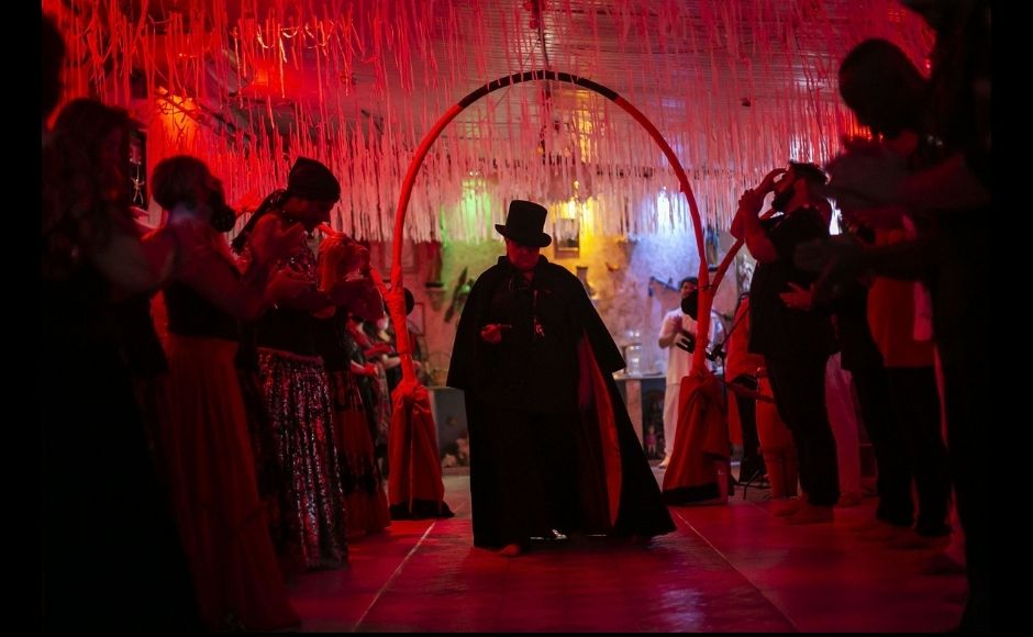 Priestess Laura D'Oya Yalorixa, center, takes part in an Umbanda religious ceremony at the Casa de Caridade Santa Barbara Iansa temple in Rio de Janeiro, Brazil, Saturday, 6 February, 2021. The faithful of the Umbanda religion, brought to America by West African slaves, perform spiritual protection rituals as part of pre-Carnival traditions. Photo via The Associated Press/Bruna Prado Priestess Laura D'Oya Yalorixa, center, takes part in an Umbanda religious ceremony at the Casa de Caridade Santa Barbara Iansa temple in Rio de Janeiro, Brazil, Saturday, 6 February, 2021. The faithful of the Umbanda religion, brought to America by West African slaves, perform spiritual protection rituals as part of pre-Carnival traditions. Photo via The Associated Press/Bruna Prado