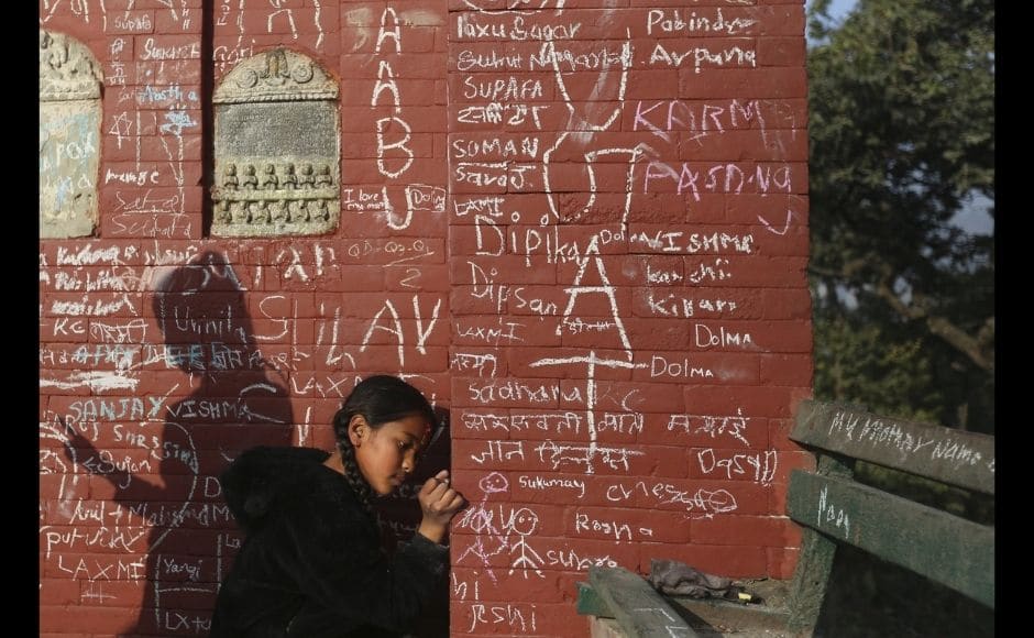 A Nepalese devotee writes her name on a Saraswati temple, with the belief that writing on the wall of a Saraswati temple on this day imparts knowledge, during Shri Panchami festival in Kathmandu, Nepal, Tuesday, 16 February, 2021. Photo via The Associated Press/Niranjan Shrestha A Nepalese devotee writes her name on a Saraswati temple, with the belief that writing on the wall of a Saraswati temple on this day imparts knowledge, during Shri Panchami festival in Kathmandu, Nepal, Tuesday, 16 February, 2021. Photo via The Associated Press/Niranjan Shrestha