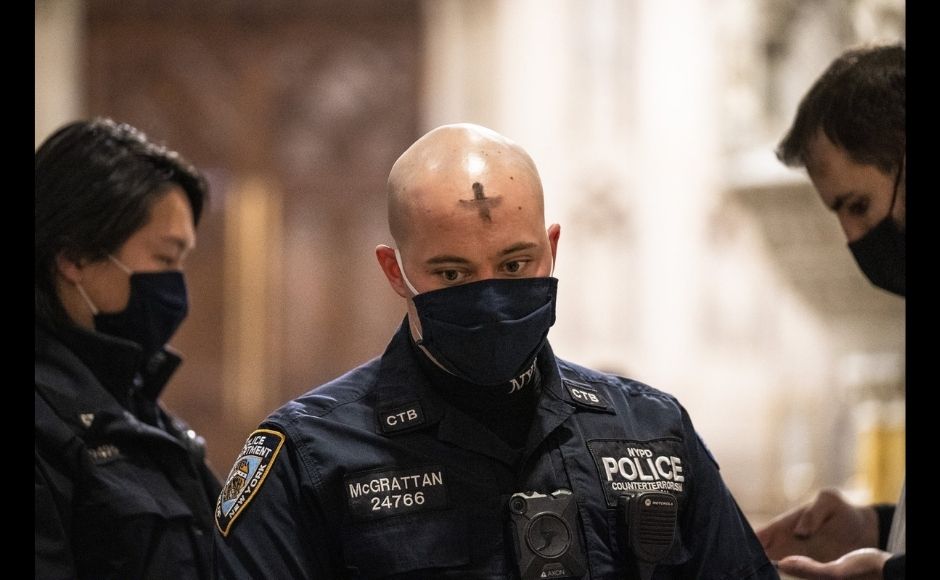 An NYPD officer receives ashes at St. Patrick's Cathedral after Ash Wednesday Mass, Wednesday, 17 February, 2021, in New York. Photo via The Associated Press/John Minchillo An NYPD officer receives ashes at St. Patrick's Cathedral after Ash Wednesday Mass, Wednesday, 17 February, 2021, in New York. Photo via The Associated Press/John Minchillo