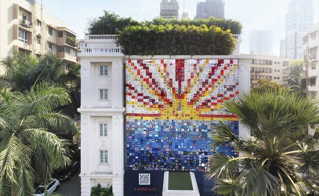 For the presentation at Jindal Mansion, Bhupal has created a modern quilt entitled A Rising Sun. The Corona Quilt Project has received over 12,000 squares from corporates, schools, NGO’s, foundations, individuals and others. Speaking about the project, Bhupal said, "My presentations have been inspired by children’s drawings and their inner innocence. Rise draws continuities and solidarities between human and nature, artificial and natural, then and now. The concepts chosen embody our current reality and consequences of the pandemic." For the presentation at Jindal Mansion, Bhupal has created a modern quilt entitled A Rising Sun. The Corona Quilt Project has received over 12,000 squares from corporates, schools, NGO’s, foundations, individuals and others. Speaking about the project, Bhupal said, "My presentations have been inspired by children’s drawings and their inner innocence. Rise draws continuities and solidarities between human and nature, artificial and natural, then and now. The concepts chosen embody our current reality and consequences of the pandemic."