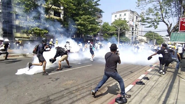 Crowds descend on Yangon streets to protest Myanmar coup, day after at least 18 died in clashes with police