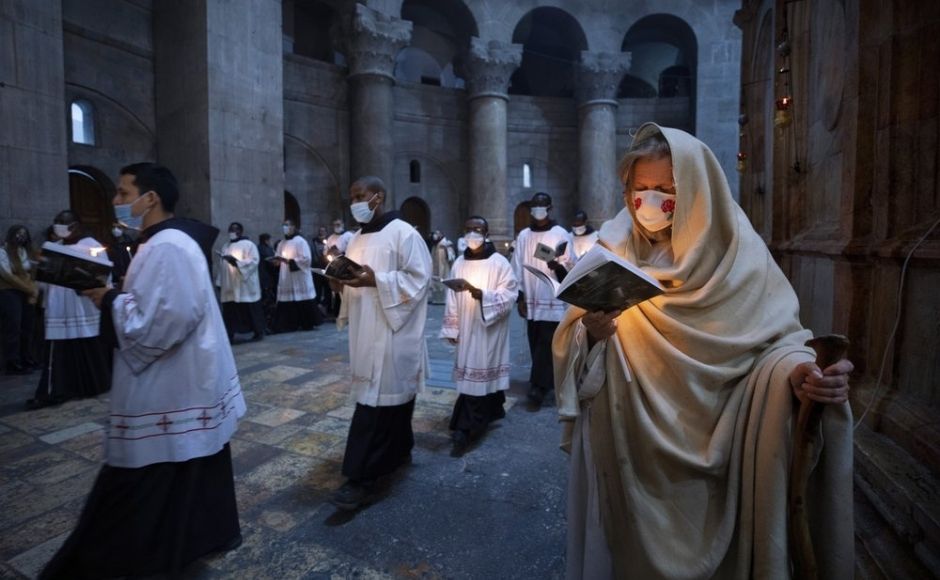 Priests circle the Edicule during Easter Sunday Mass led by the Latin Patriarch at the Church of the Holy Sepulchre, where many Christians believe Jesus was crucified, buried and rose from the dead, in the Old City of Jerusalem. Photo via The Associated Press/Oded Balilty Priests circle the Edicule during Easter Sunday Mass led by the Latin Patriarch at the Church of the Holy Sepulchre, where many Christians believe Jesus was crucified, buried and rose from the dead, in the Old City of Jerusalem. Photo via The Associated Press/Oded Balilty