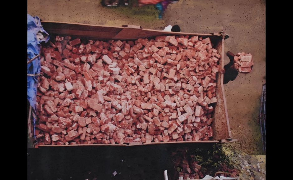 After a decade-long absence from the usual four-walled gallery space, Anjana Mehra has brought into view an omnibus of a three-part show, comprised of paintings, photographs and a video of the demolition of a two-storied old mansion.