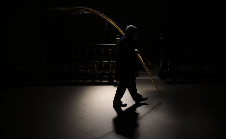 A devotee takes part in a Holy Week Palm Sunday procession at Saint Mary Cathedral, in Pamplona, northern Spain, on Sunday, 28 March, 2021. Many devotees attended the procession a year after events were cancelled due to the outbreak of the coronavirus pandemic. Photo by The Associated Press/Alvaro Barrientos A devotee takes part in a Holy Week Palm Sunday procession at Saint Mary Cathedral, in Pamplona, northern Spain, on Sunday, 28 March, 2021. Many devotees attended the procession a year after events were cancelled due to the outbreak of the coronavirus pandemic. Photo by The Associated Press/Alvaro Barrientos