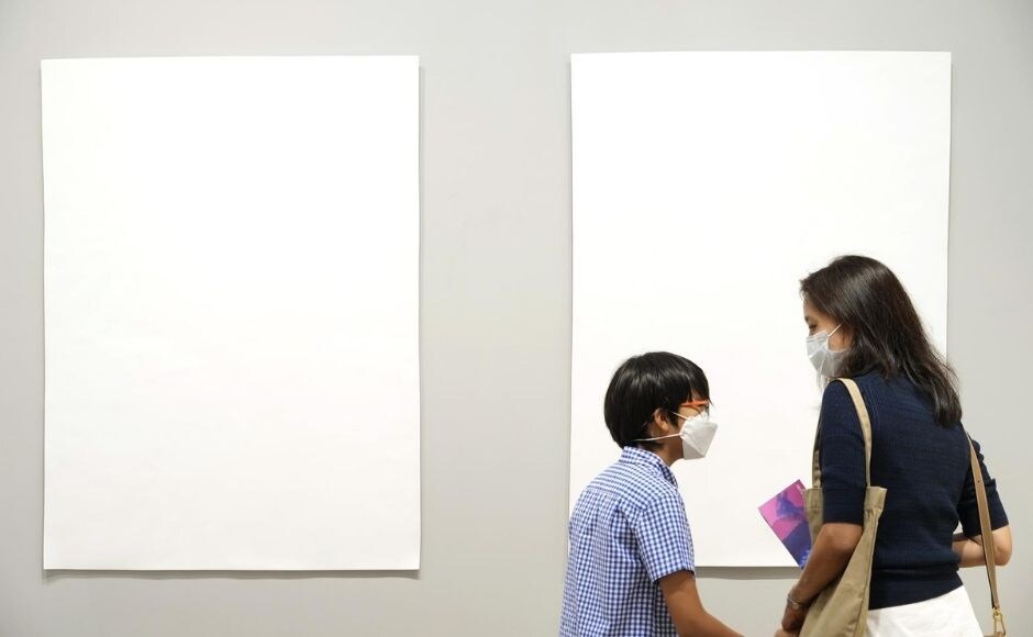 Visitors stands in front of an artwork titled "Blank Paper, 2014" created by Chinese artist Liu Jianhua at Art Basel in Hong Kong. Photo via The Associated Press/Vincent Yu Visitors stands in front of an artwork titled "Blank Paper, 2014" created by Chinese artist Liu Jianhua at Art Basel in Hong Kong. Photo via The Associated Press/Vincent Yu